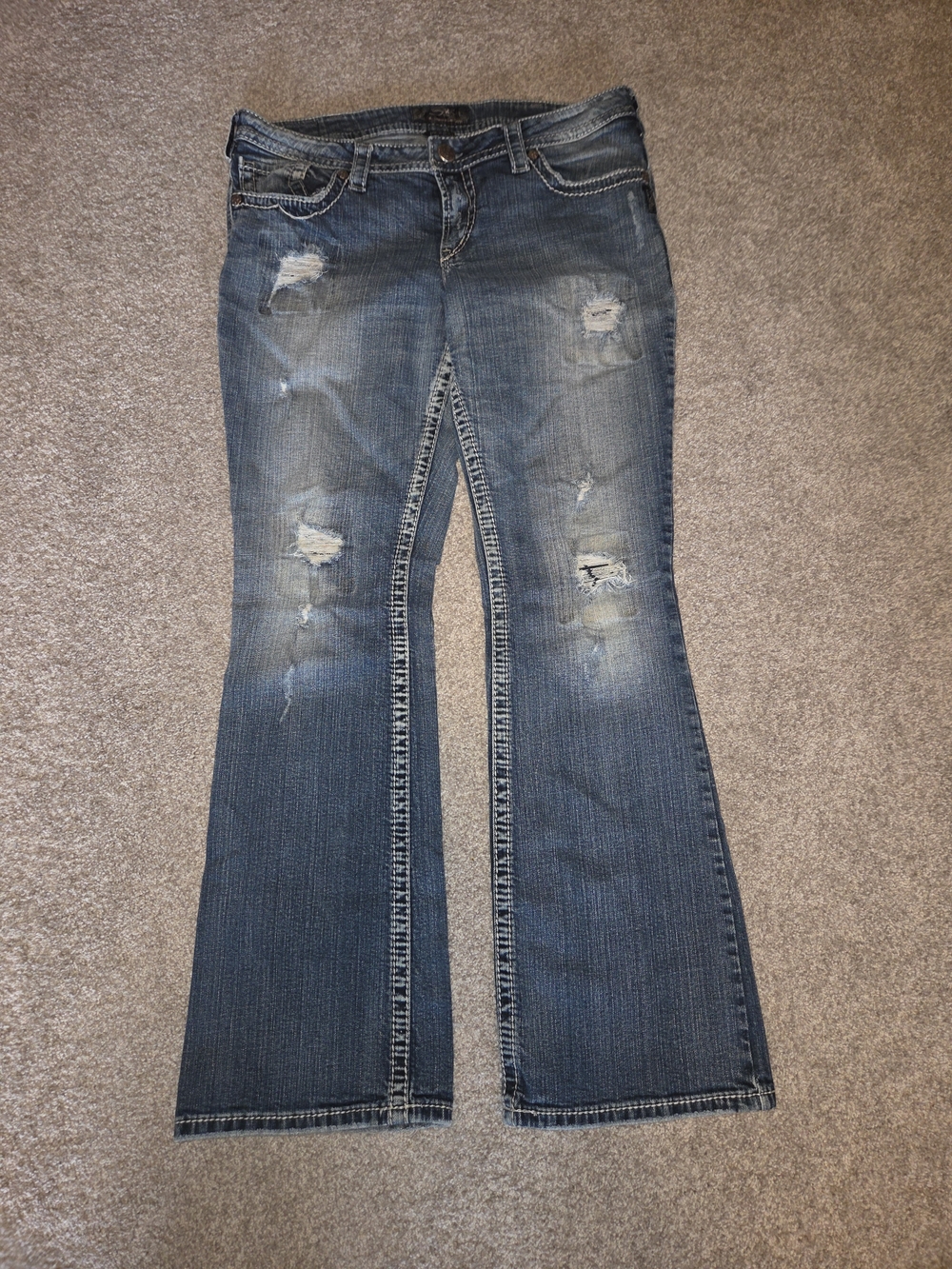 Silver Jeans Faded Blue Distressed Flare Jeans*